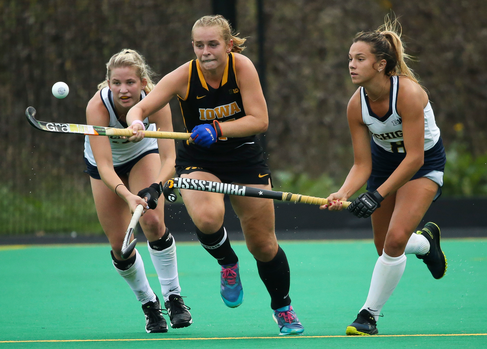 Iowa Hawkeyes midfielder Katie Birch (11) fights for possession during a game against Michigan at Grant Field on October 5, 2018. (Tork Mason/hawkeyesports.com)