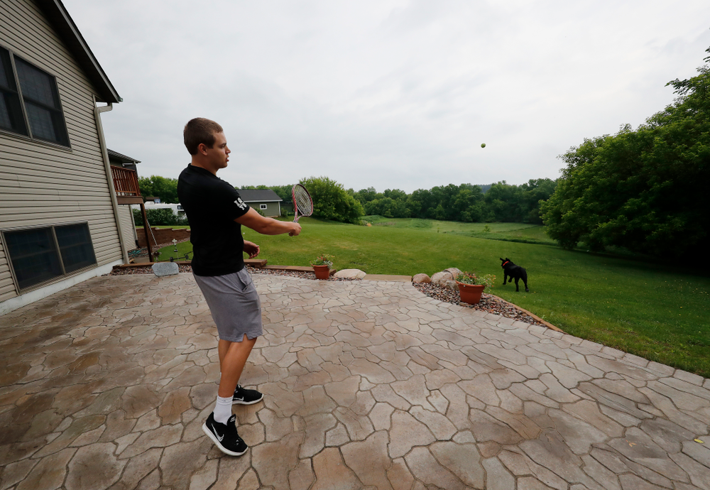 Iowa Hawkeyes quarterback Nathan Stanley (4) plays with his dog Onyx at his home Wednesday, May 30, 2018 in Menomonie, Wisc. (Brian Ray/hawkeyesports.com)