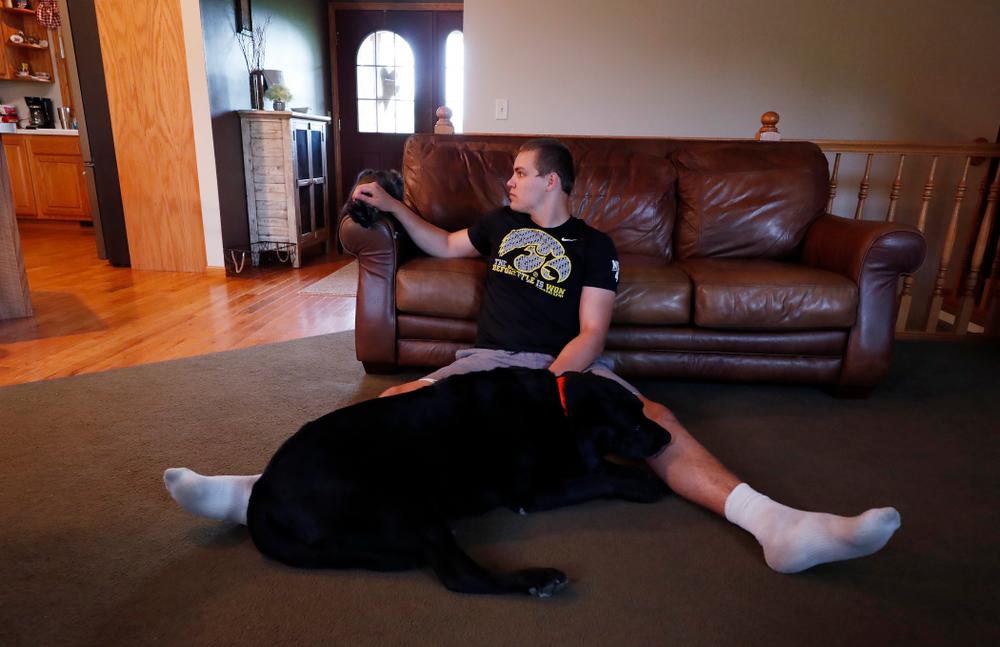 Iowa Hawkeyes quarterback Nathan Stanley (4) plays with his dog Onyx at his home Wednesday, May 30, 2018 in Menomonie, Wisc. (Brian Ray/hawkeyesports.com)