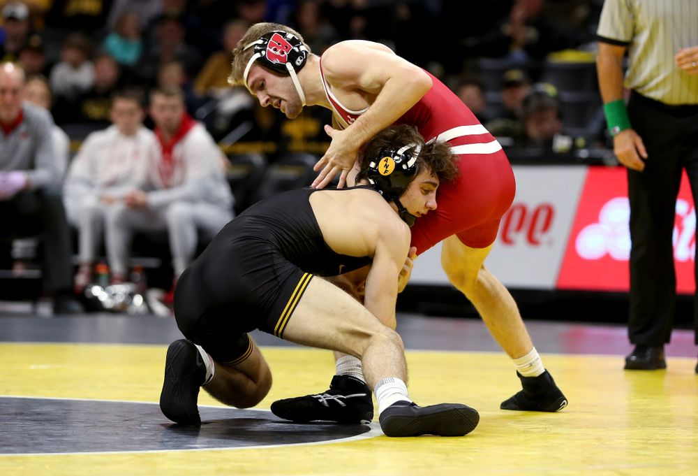 IowaÕs Austin DeSanto wrestles WisconsinÕs Seth Gross at 133 pounds Sunday, December 1, 2019 at Carver-Hawkeye Arena. DeSanto won the match 6-2. (Brian Ray/hawkeyesports.com)