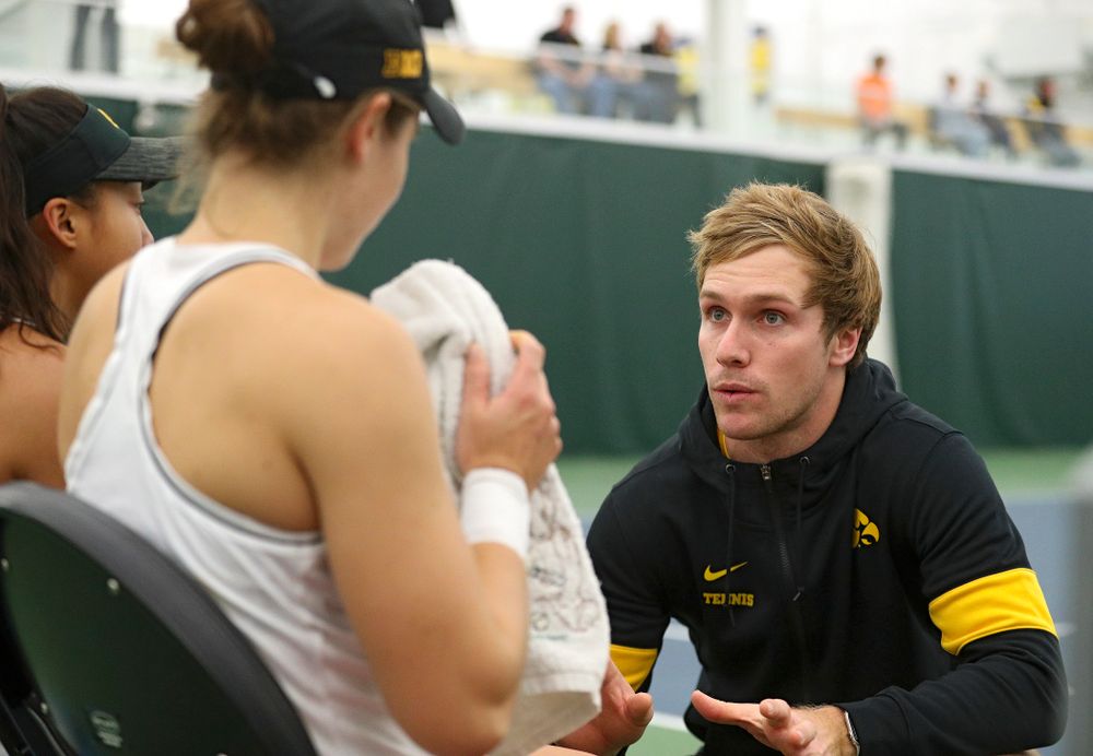 Daniel Leitner (right), program coordinator, talks with Michelle Bacalla (left) and Elise Van Heuvelen (center) during their doubles match at the Hawkeye Tennis and Recreation Complex in Iowa City on Sunday, February 16, 2020. (Stephen Mally/hawkeyesports.com)