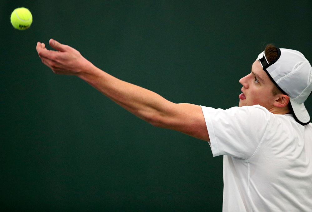 Iowa’s Joe Tyler serves during his singles match at the Hawkeye Tennis and Recreation Complex in Iowa City on Sunday, February 16, 2020. (Stephen Mally/hawkeyesports.com)
