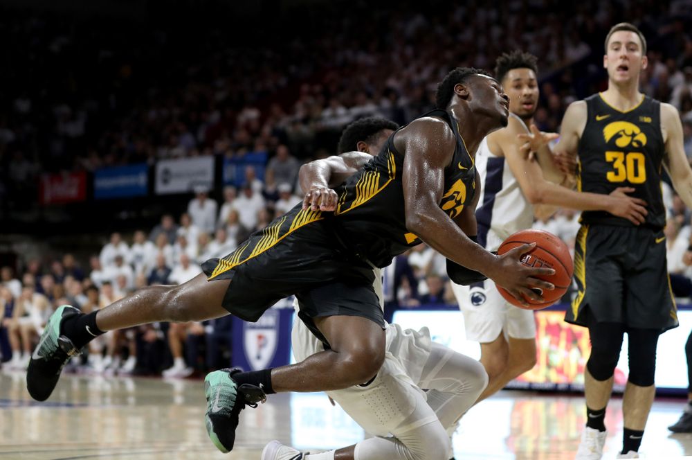 Iowa Hawkeyes guard Joe Toussaint (1) draws a foul against Penn State Saturday, January 4, 2020 at the Palestra in Philadelphia. (Brian Ray/hawkeyesports.com)