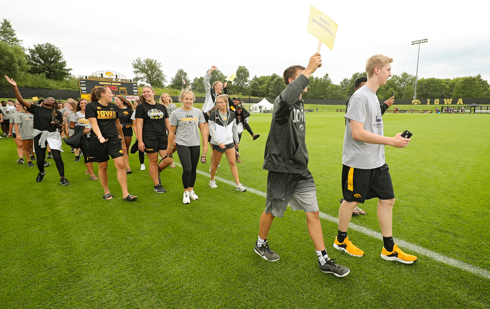 Student-athletes walk in the Parade of Champions during the Student-Athlete Kickoff at the Iowa Soccer Complex in Iowa City on Sunday, Aug 25, 2019. (Stephen Mally/hawkeyesports.com)