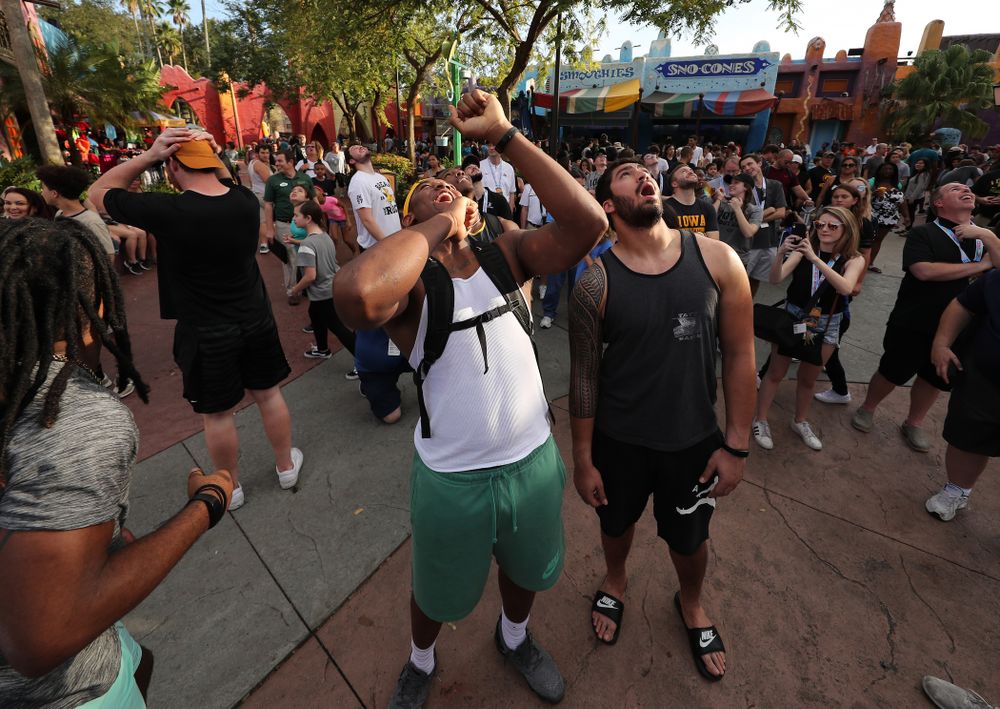 Iowa Hawkeyes defensive end Chauncey Golston (57) and defensive end A.J. Epenesa (94) react as they watch the Falcon's Fury ride during an Outback Bowl team event Saturday, December 29, 2018 at Busch Gardens in Tampa, FL. (Brian Ray/hawkeyesports.com)