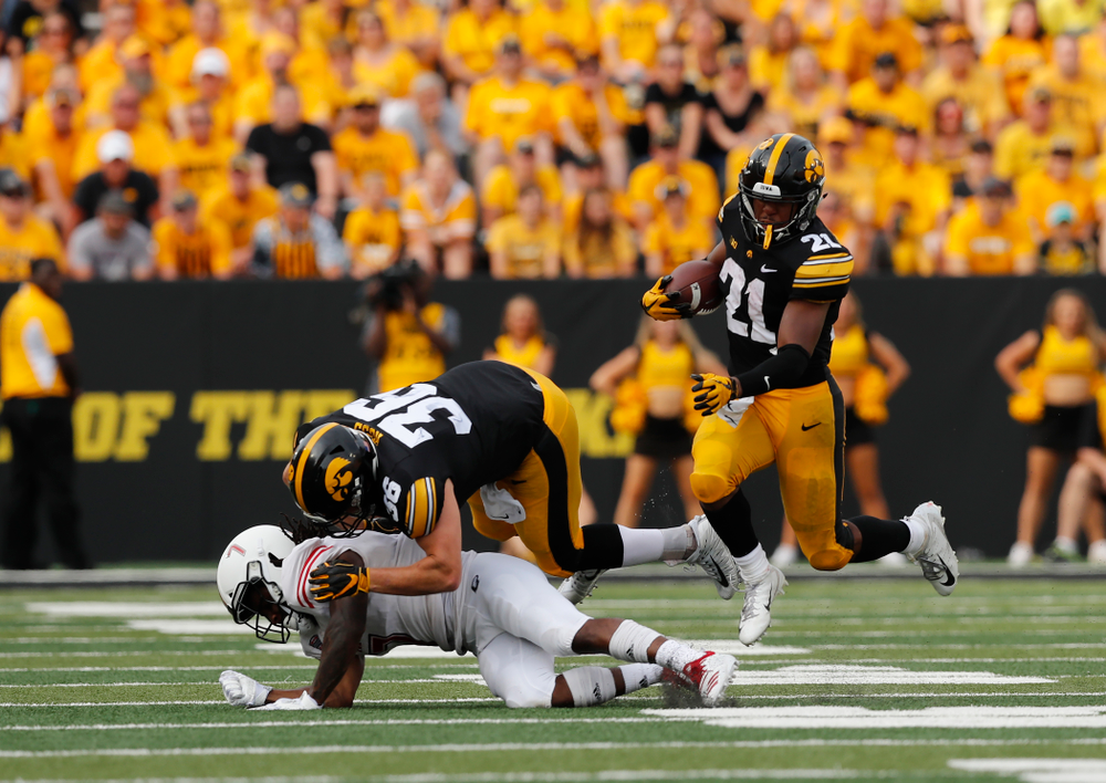 Iowa Hawkeyes running back Ivory Kelly-Martin (21) runs behind fullback Brady Ross (36) against the Northern Illinois Huskies Saturday, September 1, 2018 at Kinnick Stadium. (Brian Ray/hawkeyesports.com)
