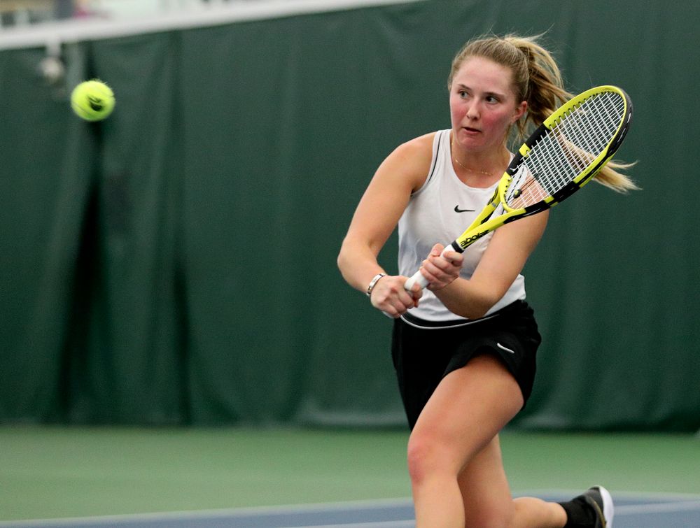 Iowa’s Danielle Burich returns a shot during her singles match at the Hawkeye Tennis and Recreation Complex in Iowa City on Sunday, February 16, 2020. (Stephen Mally/hawkeyesports.com)