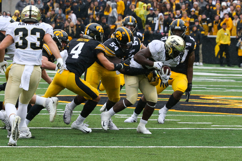 Iowa Hawkeyes defensive back Dane Belton (4) and Iowa Hawkeyes defensive tackle Daviyon Nixon (54) during Iowa football vs Purdue on Saturday, October 19, 2019 at Kinnick Stadium. (Lily Smith/hawkeyesports.com)