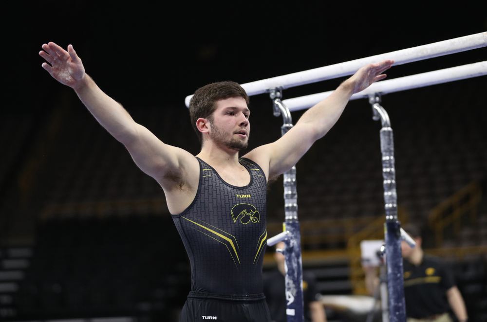 Iowa's Rogelio Vazquez competes on the parallel bars against the Ohio State Buckeyes Saturday, March 16, 2019 at Carver-Hawkeye Arena. (Brian Ray/hawkeyesports.com)