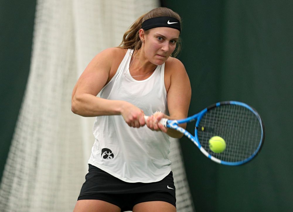 Iowa’s Ashleigh Jacobs returns a shot during her singles match at the Hawkeye Tennis and Recreation Complex in Iowa City on Sunday, February 23, 2020. (Stephen Mally/hawkeyesports.com)