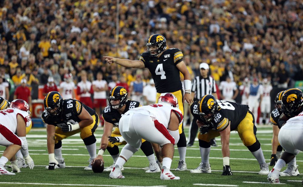 Iowa Hawkeyes offensive lineman Kyler Schott (64), offensive lineman Tyler Linderbaum (65), and offensive lineman Landan Paulsen (68) against the Miami RedHawks Saturday, August 31, 2019 at Kinnick Stadium in Iowa City. (Brian Ray/hawkeyesports.com)