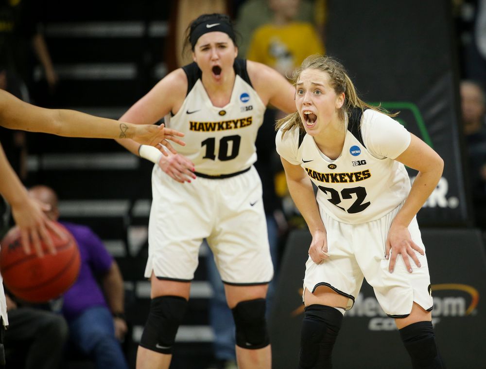 Iowa Hawkeyes center Megan Gustafson (10) and guard Kathleen Doyle (22) shout during the third quarter of their second round game in the 2019 NCAA Women's Basketball Tournament at Carver Hawkeye Arena in Iowa City on Sunday, Mar. 24, 2019. (Stephen Mally for hawkeyesports.com)