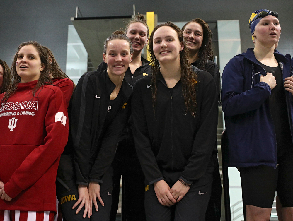 Iowa’s Hannah Burvill, Allyssa Fluit, Emilia Sansome, and Macy Rink on the podium after placing fourth in the 800 yard freestyle relay event during the 2020 Big Ten Women’s Swimming and Diving Championships at the Campus Recreation and Wellness Center in Iowa City on Wednesday, February 19, 2020. (Stephen Mally/hawkeyesports.com)