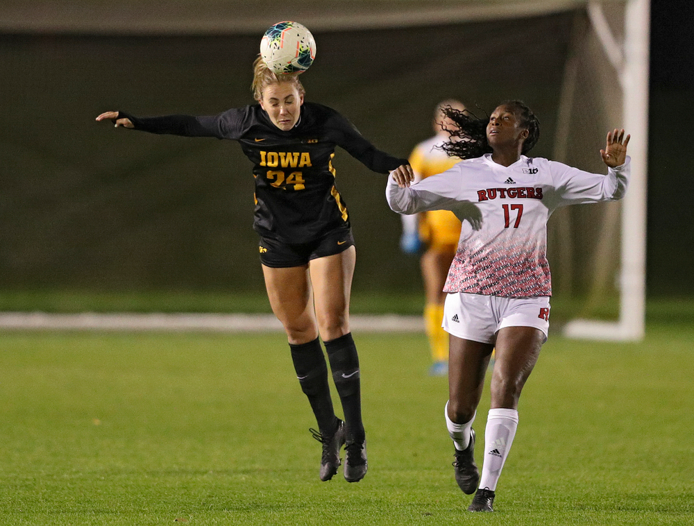 Iowa defender Sara Wheaton (24) gets up for a header during the first half of their match at the Iowa Soccer Complex in Iowa City on Friday, Oct 11, 2019. (Stephen Mally/hawkeyesports.com)