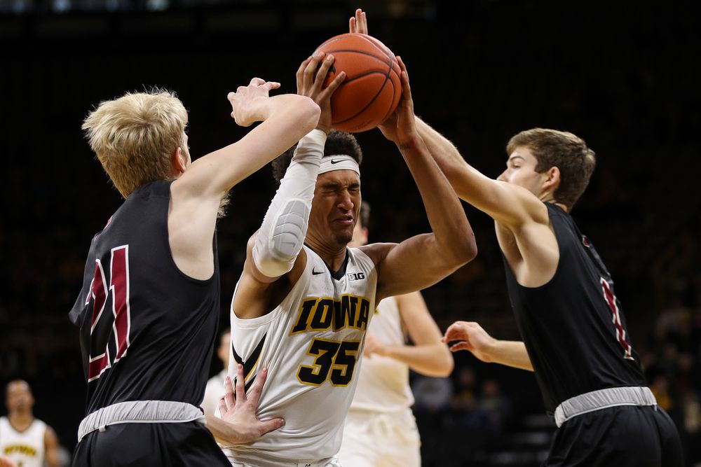 Iowa Hawkeyes forward Cordell Pemsl (35) is fouled on his way to the basket during a game against Guilford College at Carver-Hawkeye Arena on November 4, 2018. (Tork Mason/hawkeyesports.com)