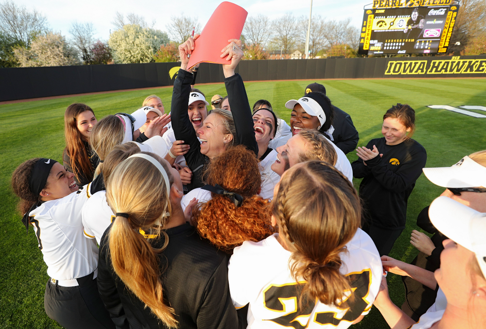 Iowa volunteer assistant coach Lori Duncan celebrates with players after winning their game against Ohio State at Pearl Field in Iowa City on Friday, May. 3, 2019. (Stephen Mally/hawkeyesports.com)