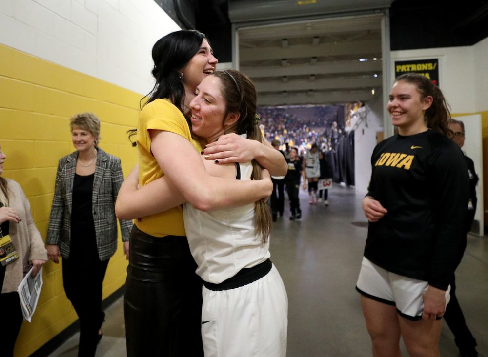 Megan Gustafson hugs Iowa Hawkeyes forward McKenna Warnock (14) following a jersey retirement ceremony Sunday, January 26, 2020 at Carver-Hawkeye Arena. (Brian Ray/hawkeyesports.com)