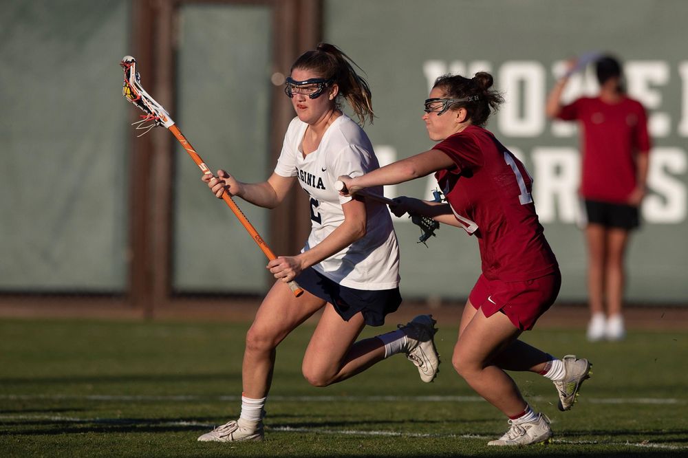STANFORD, California - FEBRUARY 14: Virginia Cavaliers midfield Sammy Mueller (2) is defended by Stanford Cardinal midfield Caitlin Chicoski (10) during the second half at Cagan Stadium on February 14, 2020 in Stanford, California. The Virginia Cavaliers defeated the Stanford Cardinal 12-11. (Photo by Jason O. Watson)