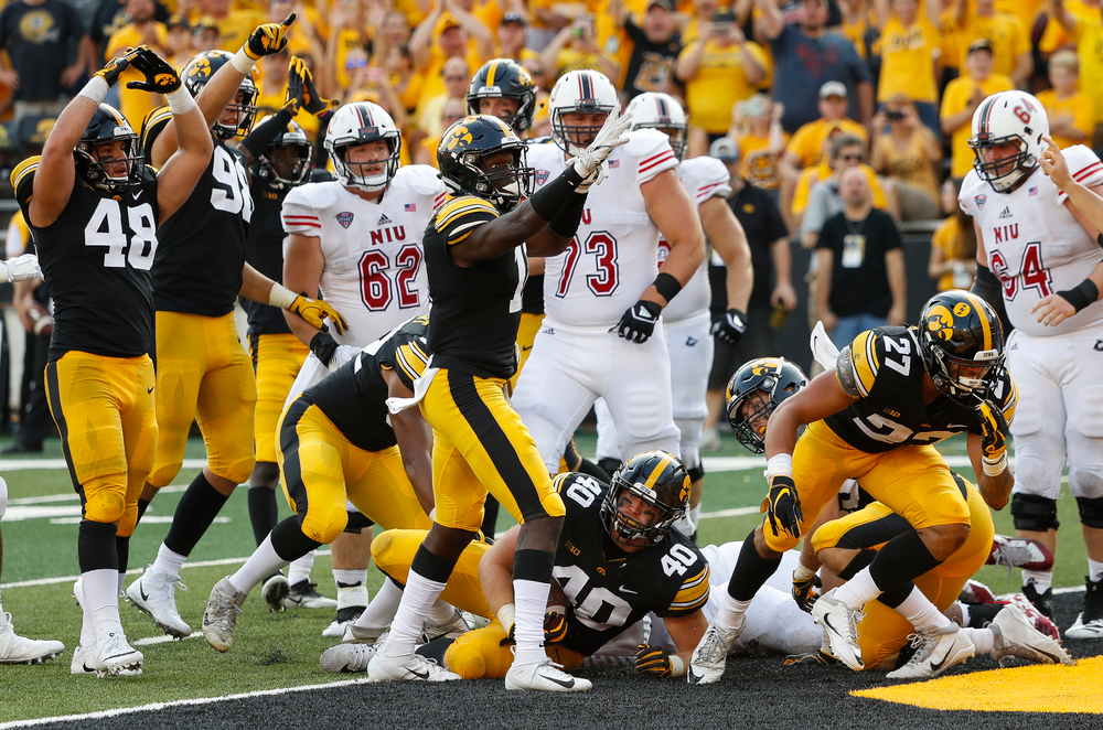 Iowa Hawkeyes linebacker Jack Hockaday (48), Iowa Hawkeyes defensive back Michael Ojemudia (11), Iowa Hawkeyes defensive end Parker Hesse (40), Iowa Hawkeyes defensive back Amani Hooker (27)