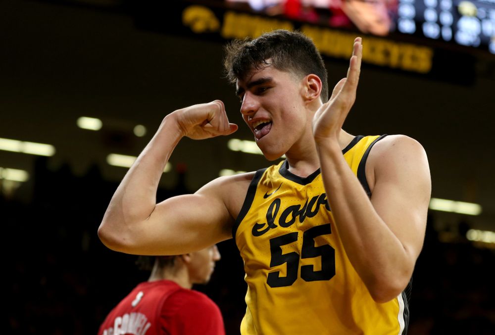 Iowa Hawkeyes forward Luka Garza (55) flexes after making a basket and drawing a foul against the Rutgers Scarlet Knights Wednesday, January 22, 2020 at Carver-Hawkeye Arena. (Brian Ray/hawkeyesports.com)