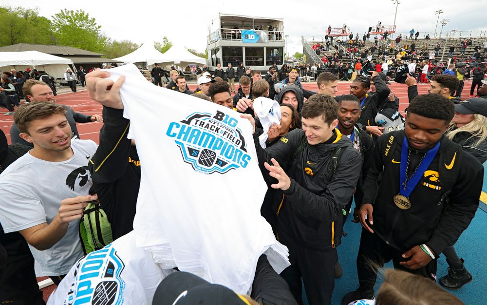 Championship shirts and hats are handed out to the Hawkeyes after winning the Men's Big Ten Outdoor Track and Field Championships on the third day of the Big Ten Outdoor Track and Field Championships at Francis X. Cretzmeyer Track in Iowa City on Sunday, May. 12, 2019. (Stephen Mally/hawkeyesports.com)