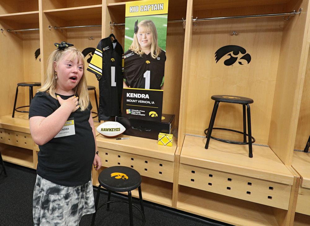 Kid Captain Kendra Hines reacts after seeing her locker in the Iowa locker room during Kids Day at Kinnick Stadium in Iowa City on Saturday, Aug 10, 2019. (Stephen Mally/hawkeyesports.com)