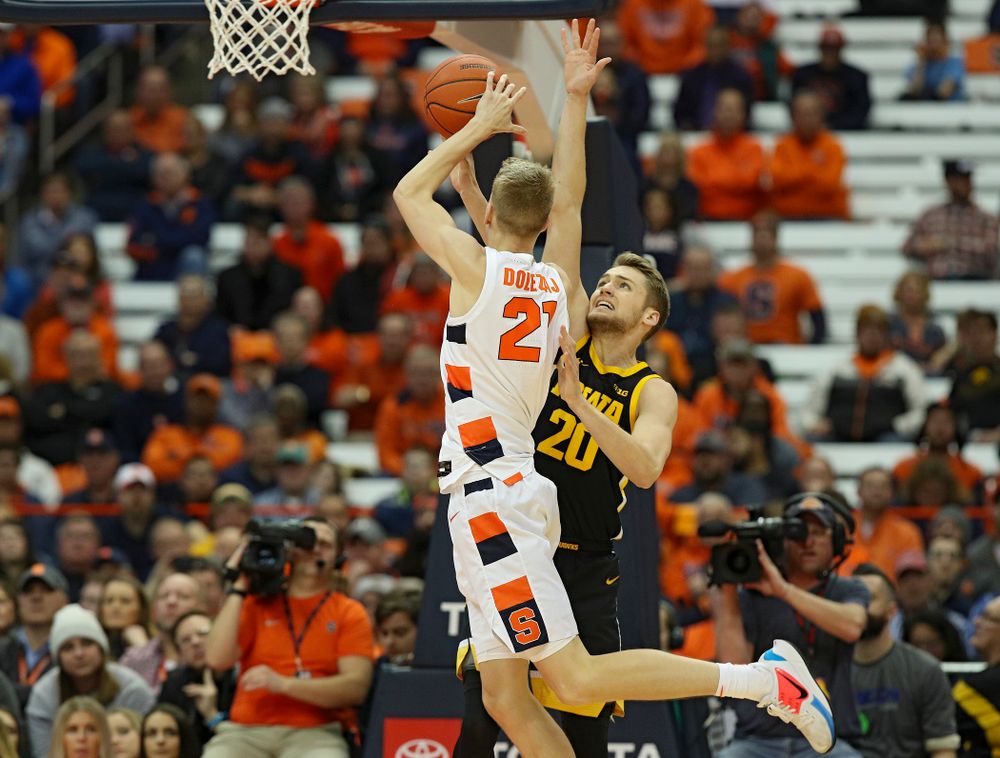 Iowa Hawkeyes forward Riley Till (20) is called for a foul as Syracuse Orange forward Marek Dolezaj (21) shoots during the first half of their ACC/Big Ten Challenge game at the Carrier Dome in Syracuse, N.Y. on Tuesday, Dec 3, 2019. (Stephen Mally/hawkeyesports.com)
