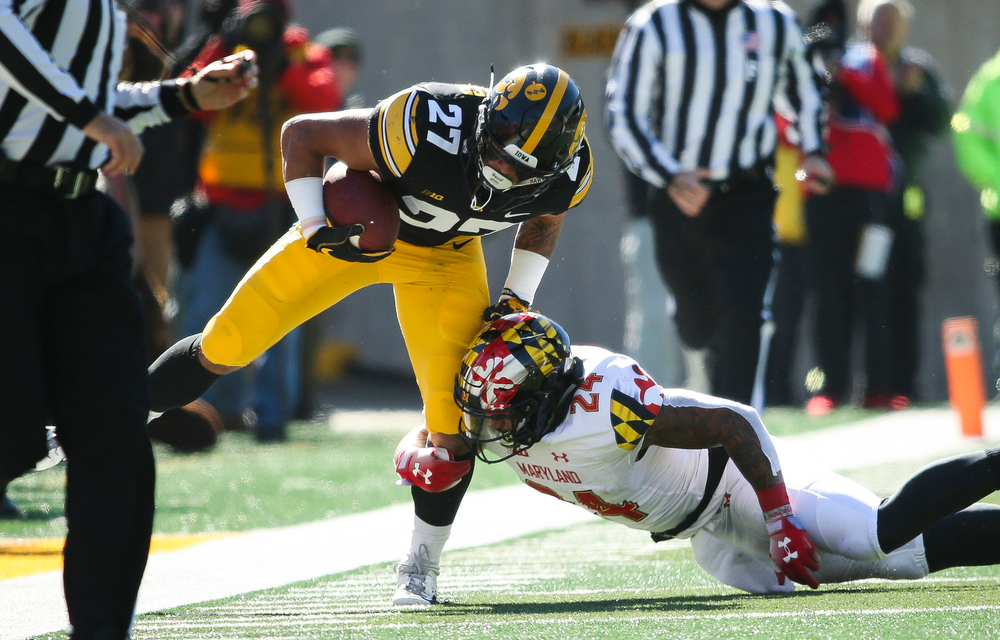 Iowa Hawkeyes defensive back Amani Hooker (27) returns an interception during a game against Maryland at Kinnick Stadium on October 20, 2018. (Tork Mason/hawkeyesports.com)
