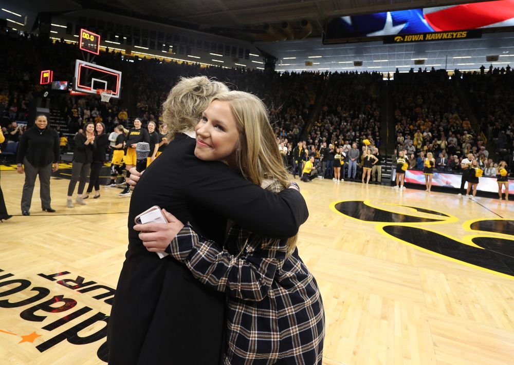 Iowa Hawkeyes head coach Lisa Bluder watches as her daughter Emma sings the National Anthem before the Iowa Hawkeyes game against the Northwestern Wildcats Sunday, March 3, 2019 at Carver-Hawkeye Arena. (Brian Ray/hawkeyesports.com)