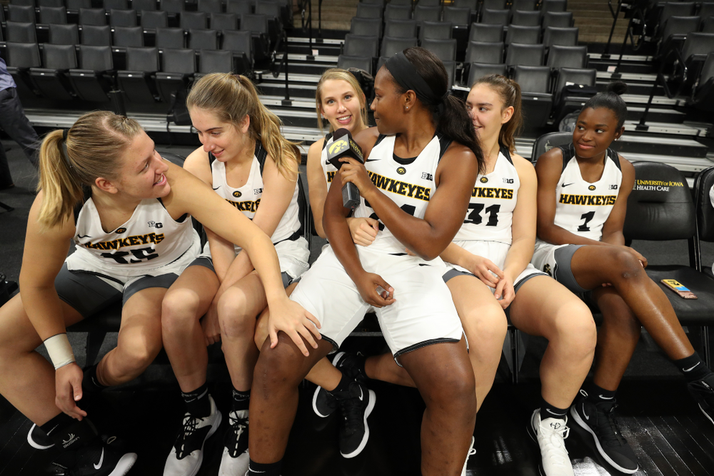 Iowa Hawkeyes guard Zion Sanders (24) interviews her teammates for a Facebook Live during the team's annual media day Wednesday, October 31, 2018 at Carver-Hawkeye Arena. (Brian Ray/hawkeyesports.com)