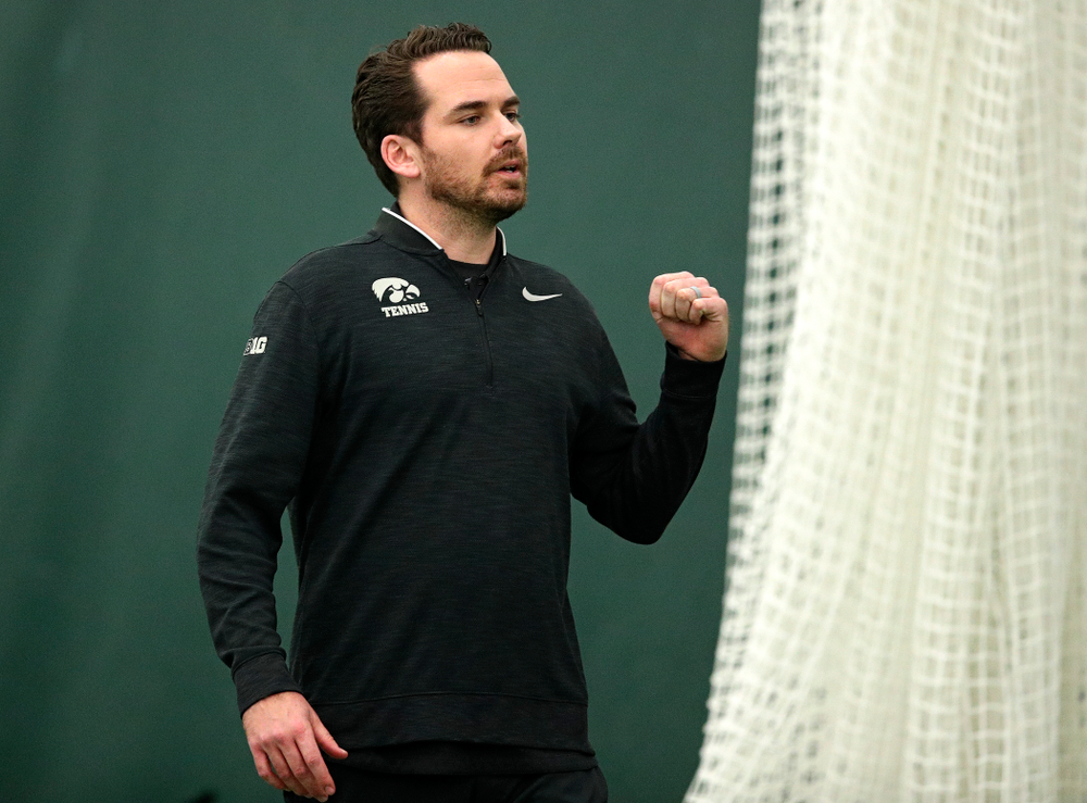 Mellecker Family Head Men's Tennis Coach Ross Wilson celebrates a point during a doubles match at the Hawkeye Tennis and Recreation Complex in Iowa City on Friday, February 14, 2020. (Stephen Mally/hawkeyesports.com)