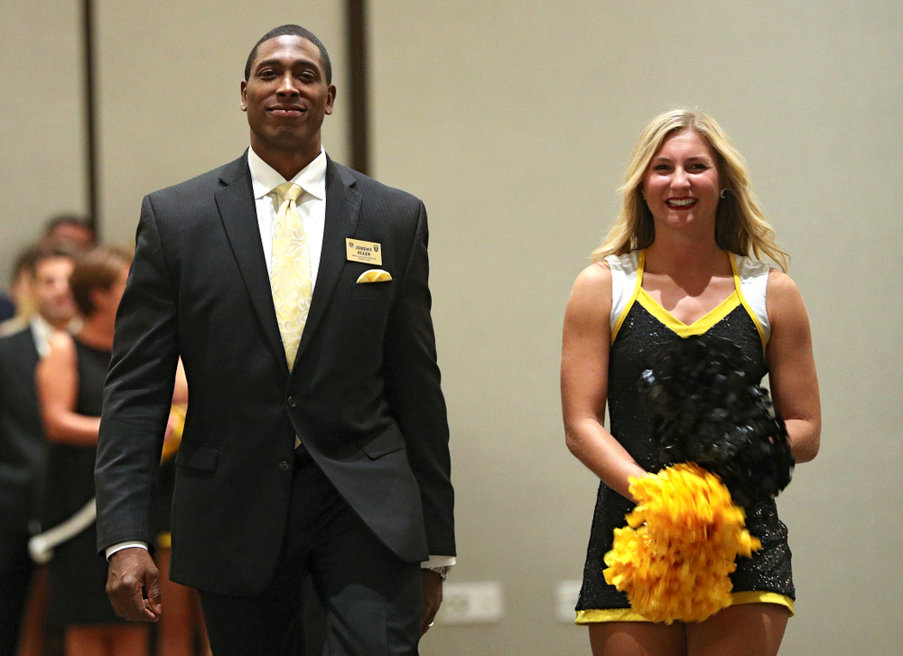 2019 University of Iowa Athletics Hall of Fame inductee Jeremy Allen walks to his seat with a Spirit Squad member during the Hall of Fame Induction Ceremony at the Coralville Marriott Hotel and Conference Center in Coralville on Friday, Aug 30, 2019. (Stephen Mally/hawkeyesports.com)