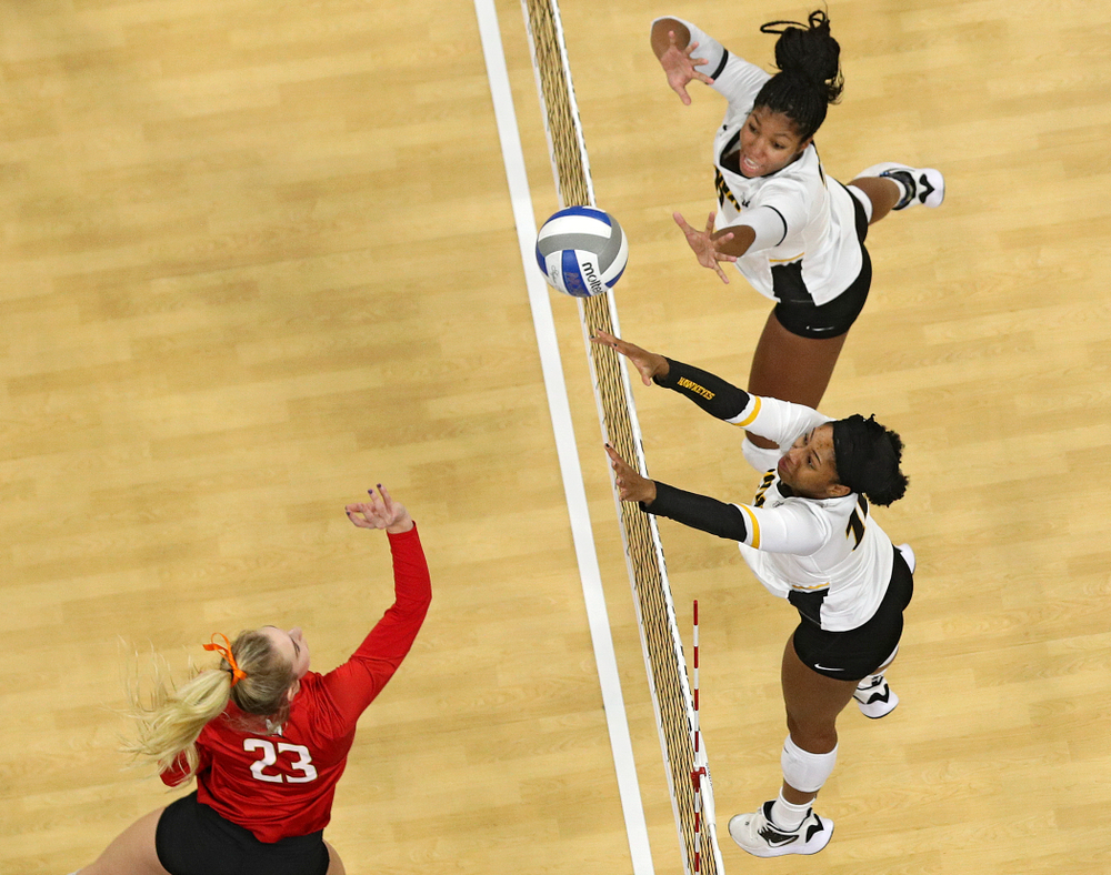 Iowa’s Griere Hughes (bottom) and Amiya Jones (top) reach for the ball during the second set of their match at Carver-Hawkeye Arena in Iowa City on Saturday, Nov 30, 2019. (Stephen Mally/hawkeyesports.com)
