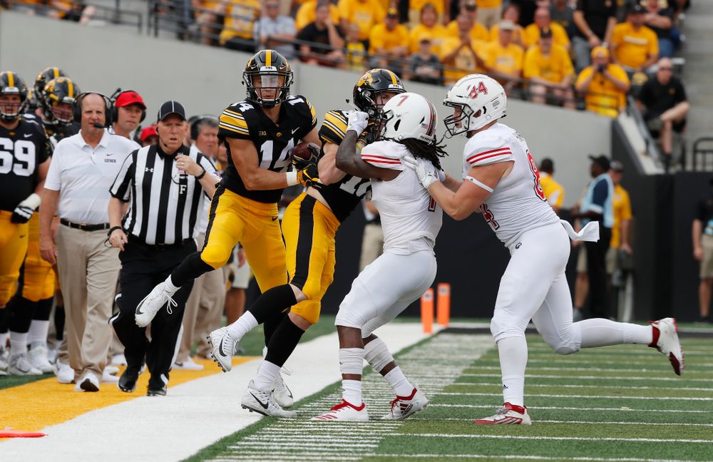 Iowa Hawkeyes wide receiver Kyle Groeneweg (14) returns a punt against the Northern Illinois Huskies Saturday, September 1, 2018 at Kinnick Stadium. (Brian Ray/hawkeyesports.com)
