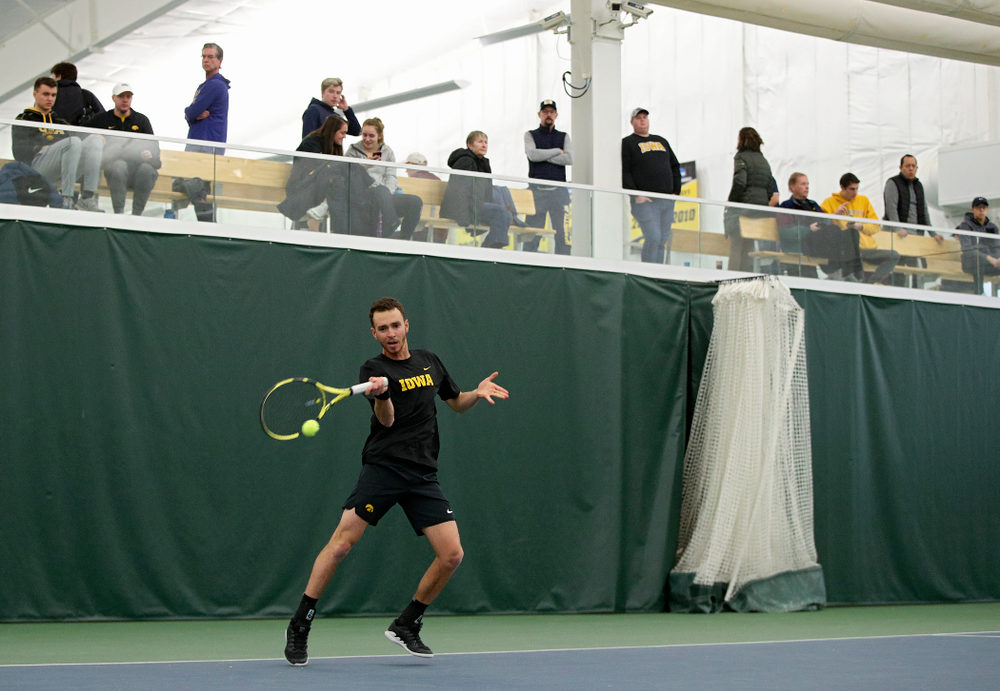 Iowa’s Kareem Allaf hits a shot during his match against Marquette at the Hawkeye Tennis and Recreation Complex in Iowa City on Saturday, January 25, 2020. (Stephen Mally/hawkeyesports.com)