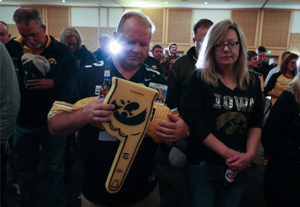 Fans pause for a moment of silence honorary Hayden Fry and Bump Elliott during the Holiday Bowl Hawkeye Huddle Thursday, December 26, 2019 at the Hilton in downtown San Diego. (Brian Ray/hawkeyesports.com)