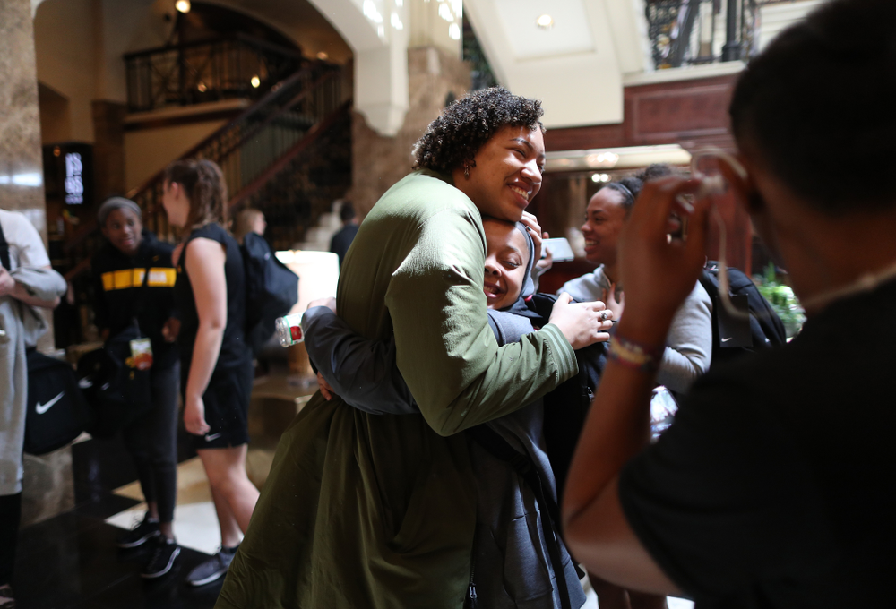 Former Hawkeye Chase Coley hugs the players following shoot around before their regional final against the Baylor Lady Bears in the 2019 NCAA Women's College Basketball Tournament Monday, April 1, 2019 at Greensboro Coliseum in Greensboro, NC.(Brian Ray/hawkeyesports.com)