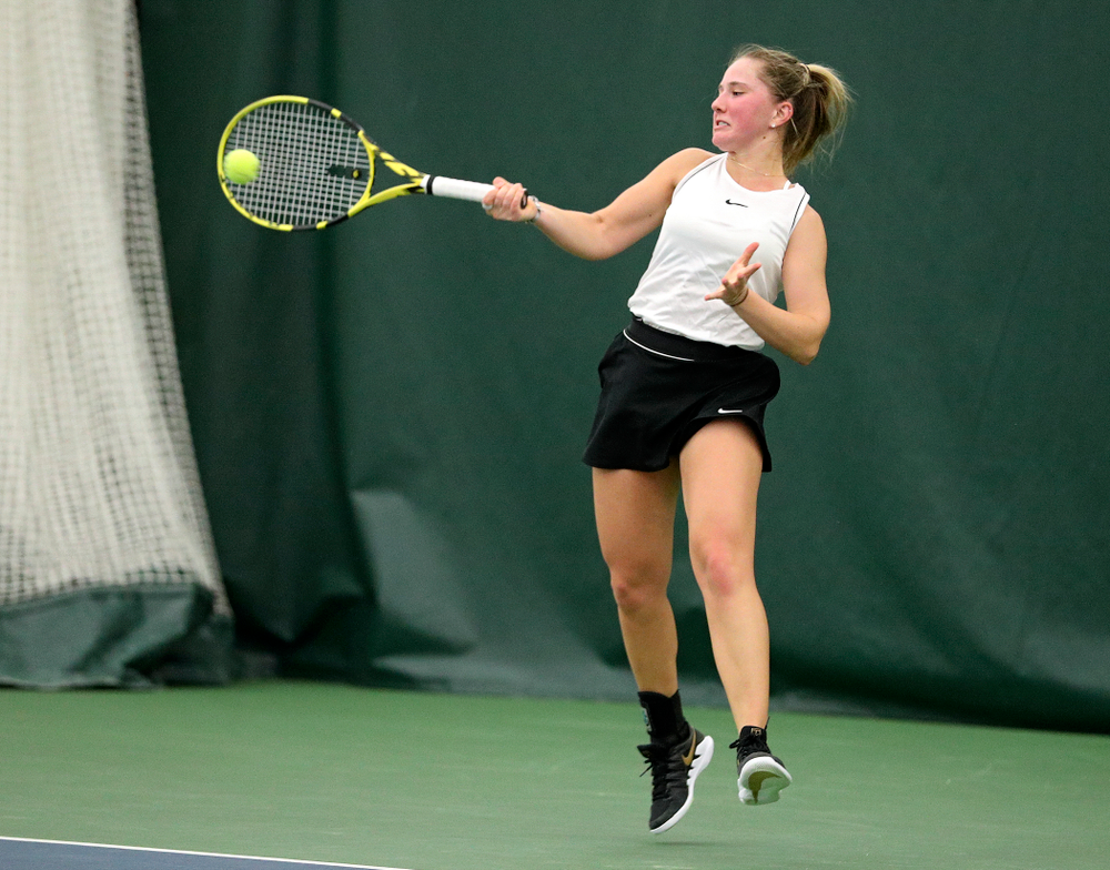 Iowa’s Danielle Burich returns a shot during her singles match at the Hawkeye Tennis and Recreation Complex in Iowa City on Sunday, February 16, 2020. (Stephen Mally/hawkeyesports.com)