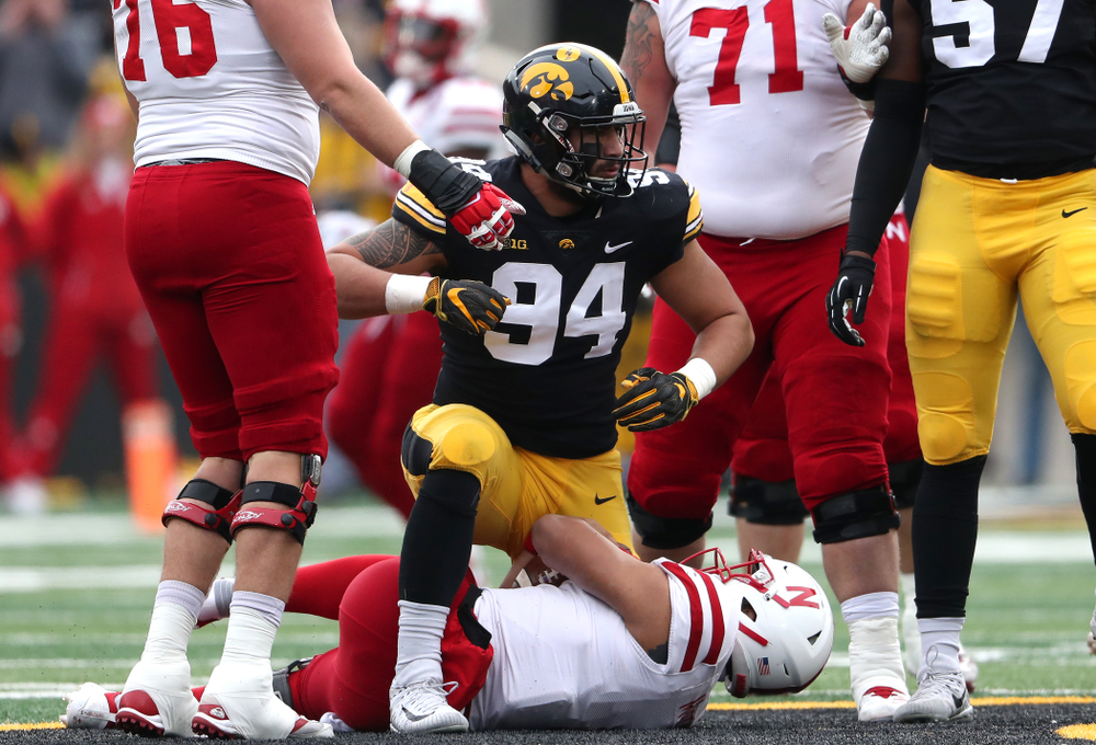 Iowa Hawkeyes defensive end A.J. Epenesa (94) sacks Nebraska Cornhuskers quarterback Adrian Martinez (2) Friday, November 23, 2018 at Kinnick Stadium. (Brian Ray/hawkeyesports.com)