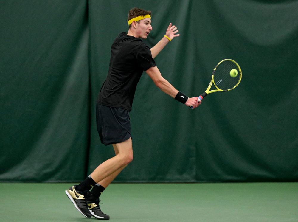 Iowa’s Nikita Snezhko returns a shot during his doubles match at the Hawkeye Tennis and Recreation Complex in Iowa City on Thursday, January 16, 2020. (Stephen Mally/hawkeyesports.com)