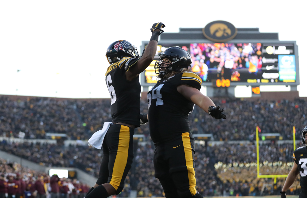 Iowa Hawkeyes wide receiver Ihmir Smith-Marsette (6) and offensive lineman Kyler Schott (64) against Minnesota Saturday, September 28, 2019 at Kinnick Stadium. (Max Allen/hawkeyesports.com)