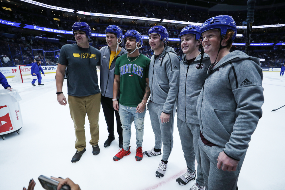Iowa Hawkeyes tight end T.J. Hockenson (38), quarterback Nate Stanley (4), and defensive back Amani Hooker (27) following an on ice contest against Mississippi State during the first intermission of the Tampa Bay Lightning game Thursday, December 27, 2018 at Amalie Arena. (Brian Ray/hawkeyesports.com)