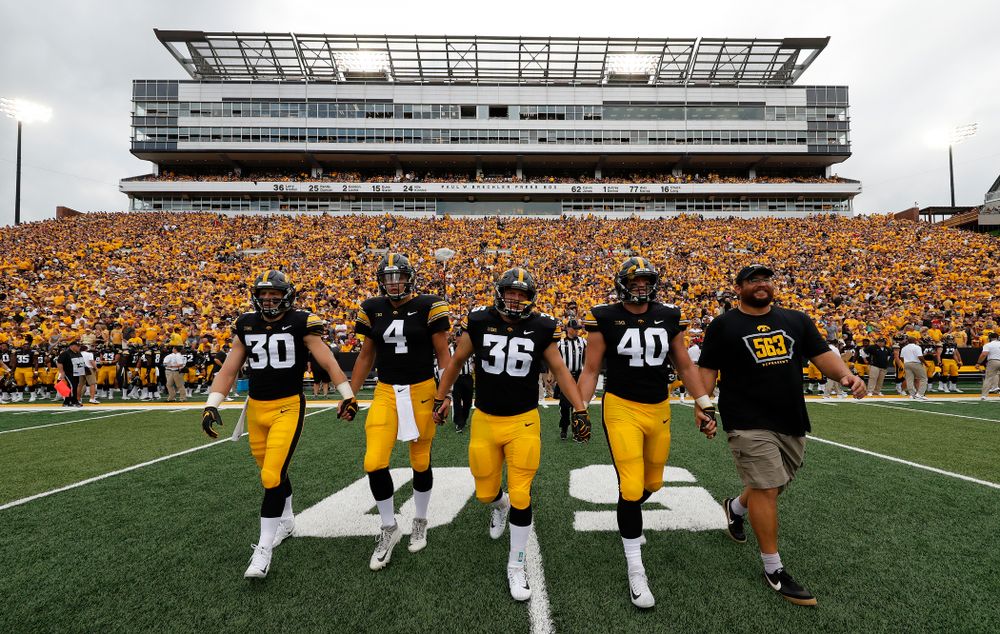 Captains Jake Gervase, Nate Stanley, Brady Ross, Parker Hesse, and Honorary Captain Julian Vandervelde against the Norther Illinois Huskies Saturday, September 1, 2018 . (Brian Ray/hawkeyesports.com)