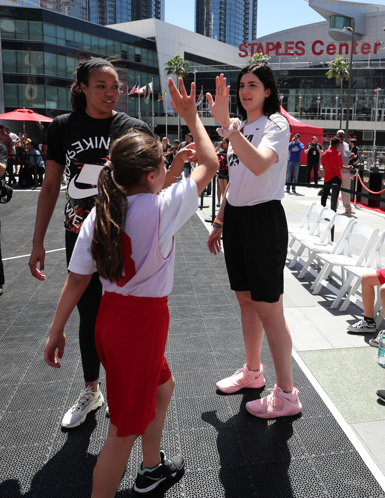 Iowa Hawkeyes forward Megan Gustafson (10) and UCONNÕs Napheesa Collier coach a team during a youth clinic and game Friday, April 12, 2019 in the XBOX Plaza at LA Live. (Brian Ray/hawkeyesports.com)