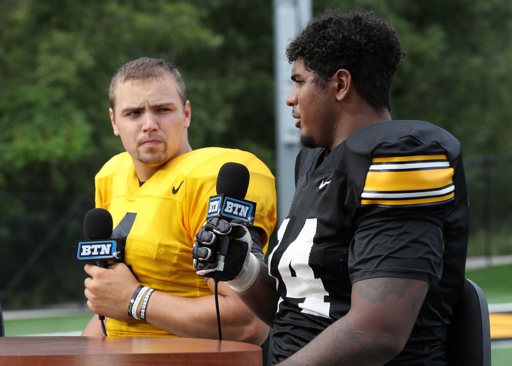 Iowa Hawkeyes quarterback Nate Stanley (4) and offensive lineman Tristan Wirfs (74) on the set of the BTN Tailgate Tour following fall camp Practice No. 16 Tuesday, August 20, 2019 at the Ronald D. and Margaret L. Kenyon Football Practice Facility. (Brian Ray/hawkeyesports.com)