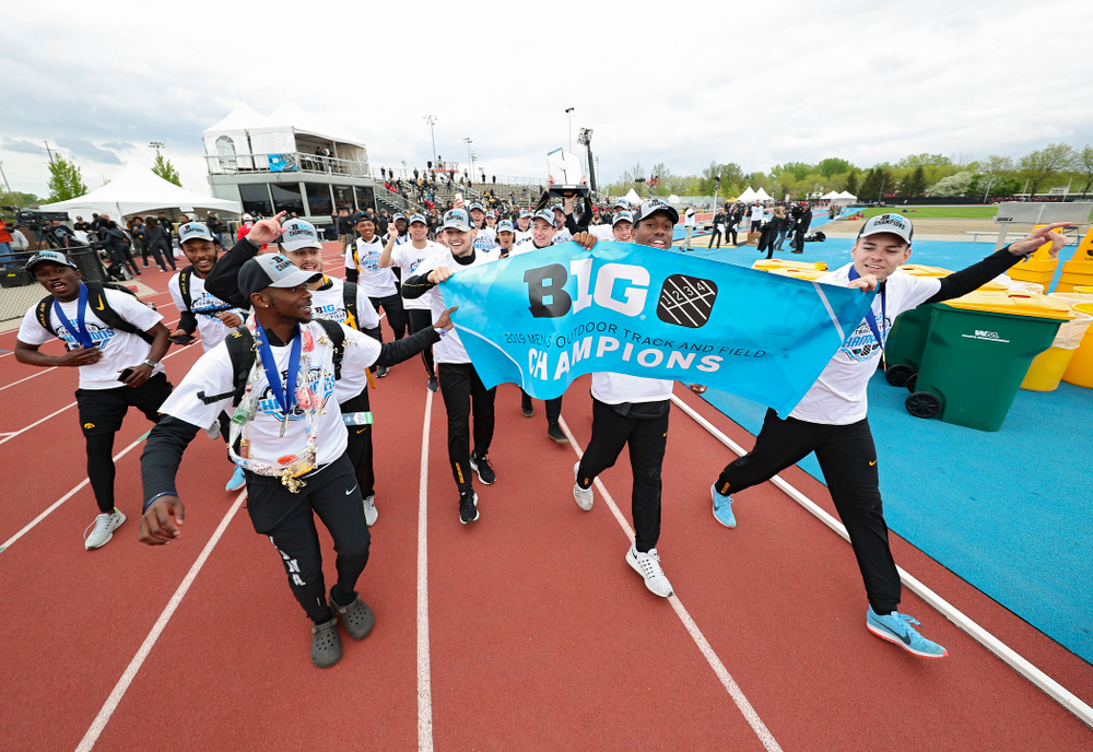 The Hawkeyes take a trip around the track as they celebrate after winning the Men's Big Ten Outdoor Track and Field Championships on the third day of the Big Ten Outdoor Track and Field Championships at Francis X. Cretzmeyer Track in Iowa City on Sunday, May. 12, 2019. (Stephen Mally/hawkeyesports.com)