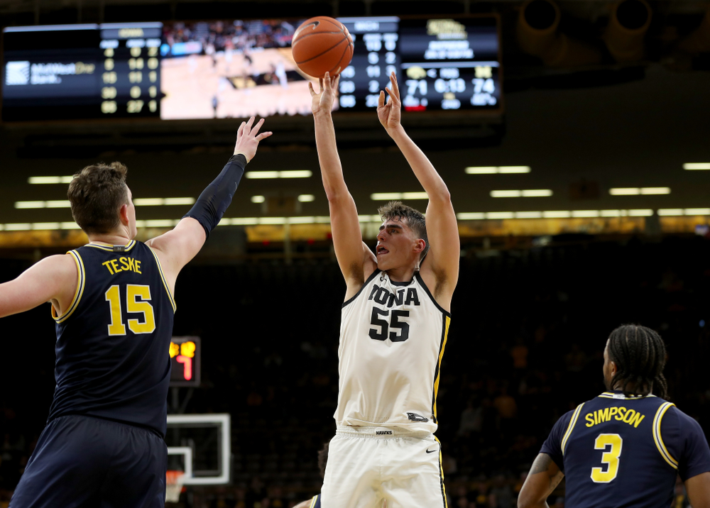 Iowa Hawkeyes forward Luka Garza (55) pulls up for a shot against the Michigan Wolverines Friday, January 17, 2020 at Carver-Hawkeye Arena. (Brian Ray/hawkeyesports.com)