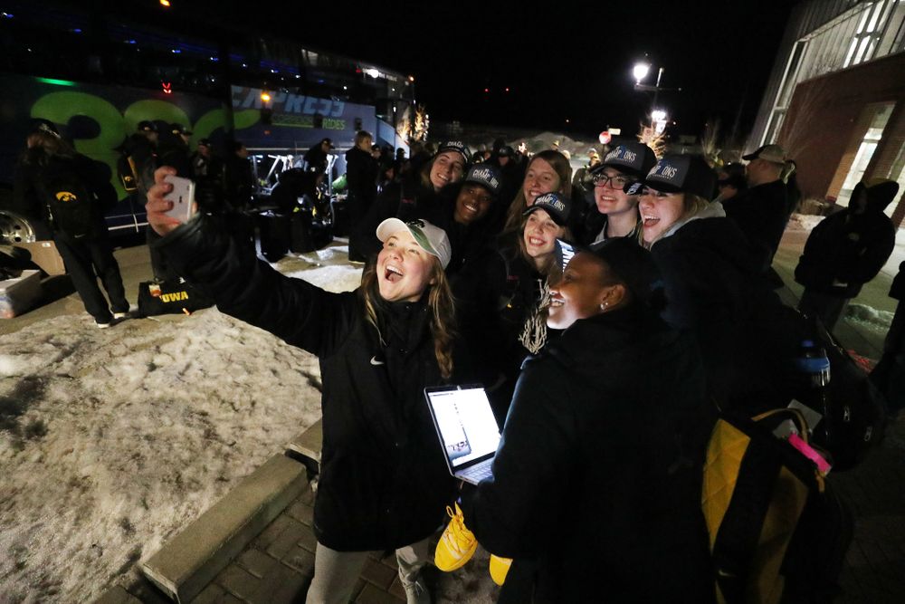 The Iowa Hawkeyes celebrate with fans as they arrive back in Coralville after defeating the Maryland Terrapins in the Big Ten Championship Game Sunday, March 10, 2019 in Indianapolis, Ind. (Brian Ray/hawkeyesports.com)