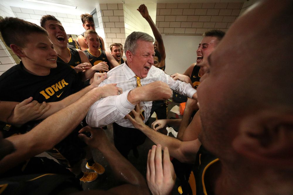 Iowa Hawkeyes assistant coach Kirk Speraw dances with the players as they celebrate their win against the Iowa State Cyclones Thursday, December 12, 2019 at Hilton Coliseum in Ames, Iowa(Brian Ray/hawkeyesports.com)