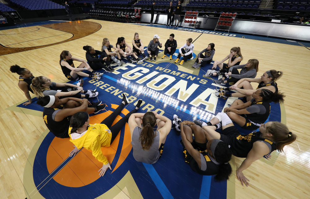 The Iowa Hawkeyes talk in their circle at the end of shoot around before their game against the NC State Wolfpack in the regional semi-final of the 2019 NCAA Women's College Basketball Tournament Saturday, March 30, 2019 at Greensboro Coliseum in Greensboro, NC.(Brian Ray/hawkeyesports.com)
